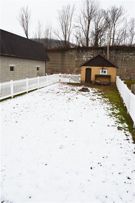 113 Riverside Drive Freeport, PA 16229 - Photo 22 of 25 Fenced FLAT Rear Yard. Garage. Fire Pit Area.