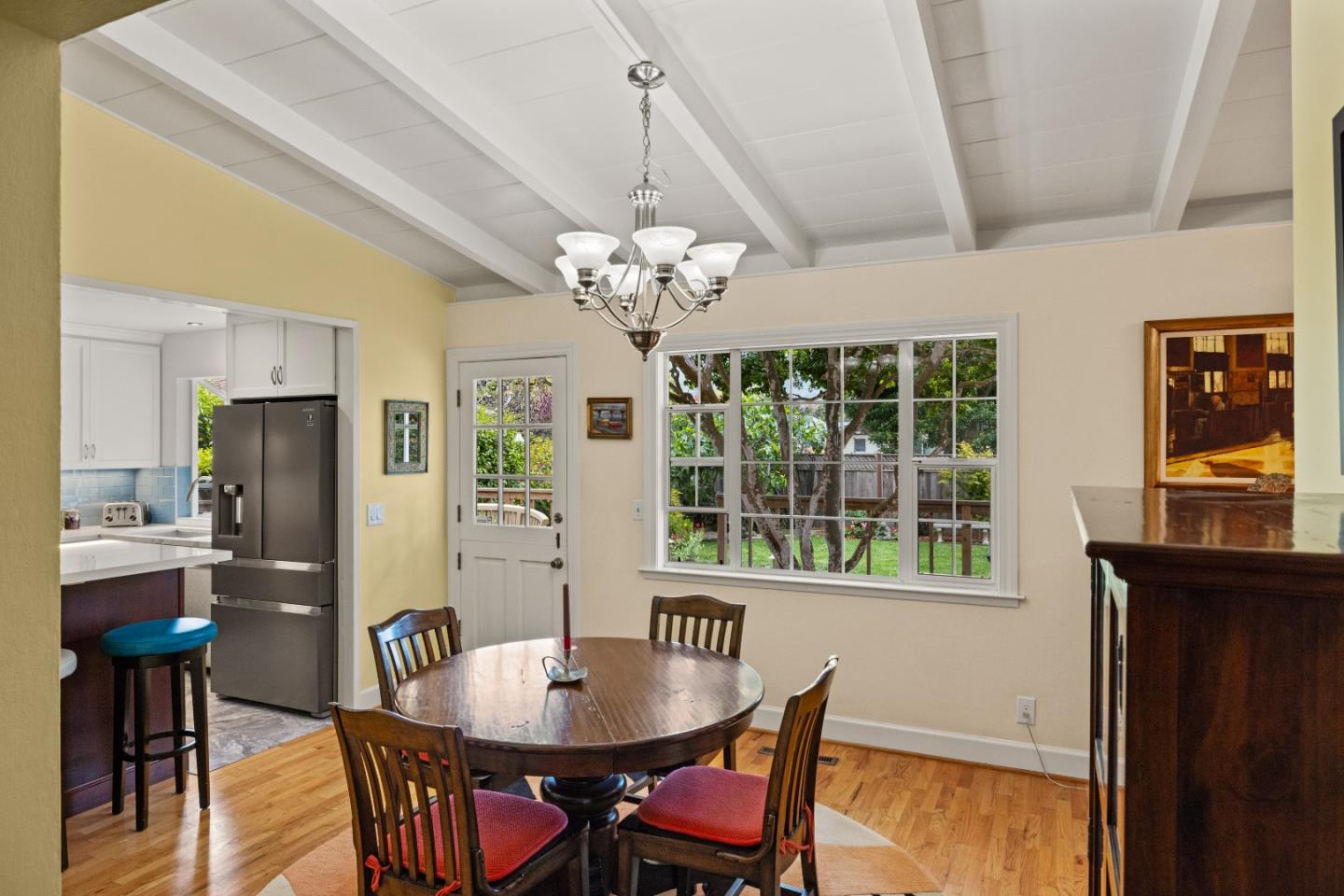 3532 Oliver Road Carmel, CA 93923 - Photo 11 of 47 a dining room with furniture a chandelier and wooden floor