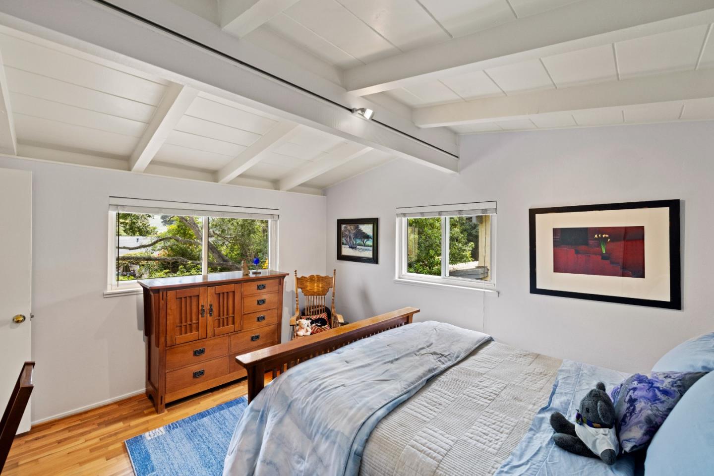 3532 Oliver Road Carmel, CA 93923 - Photo 19 of 47 a bedroom with a bed and wooden floor