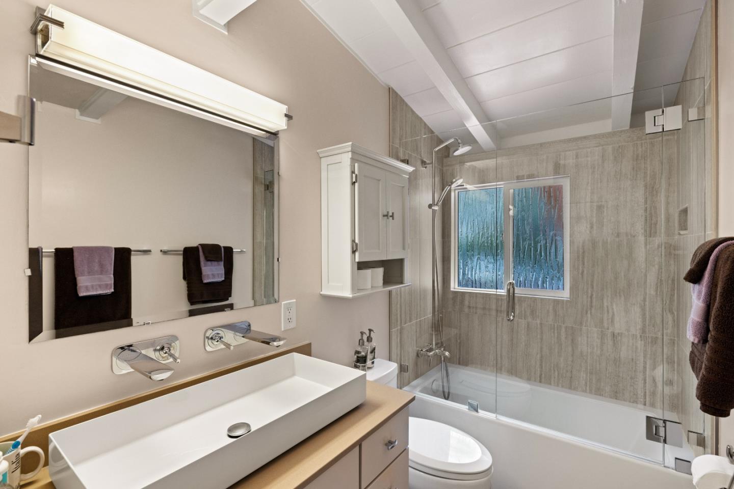 3532 Oliver Road Carmel, CA 93923 - Photo 20 of 47 a bathroom with a toilet sink and mirror