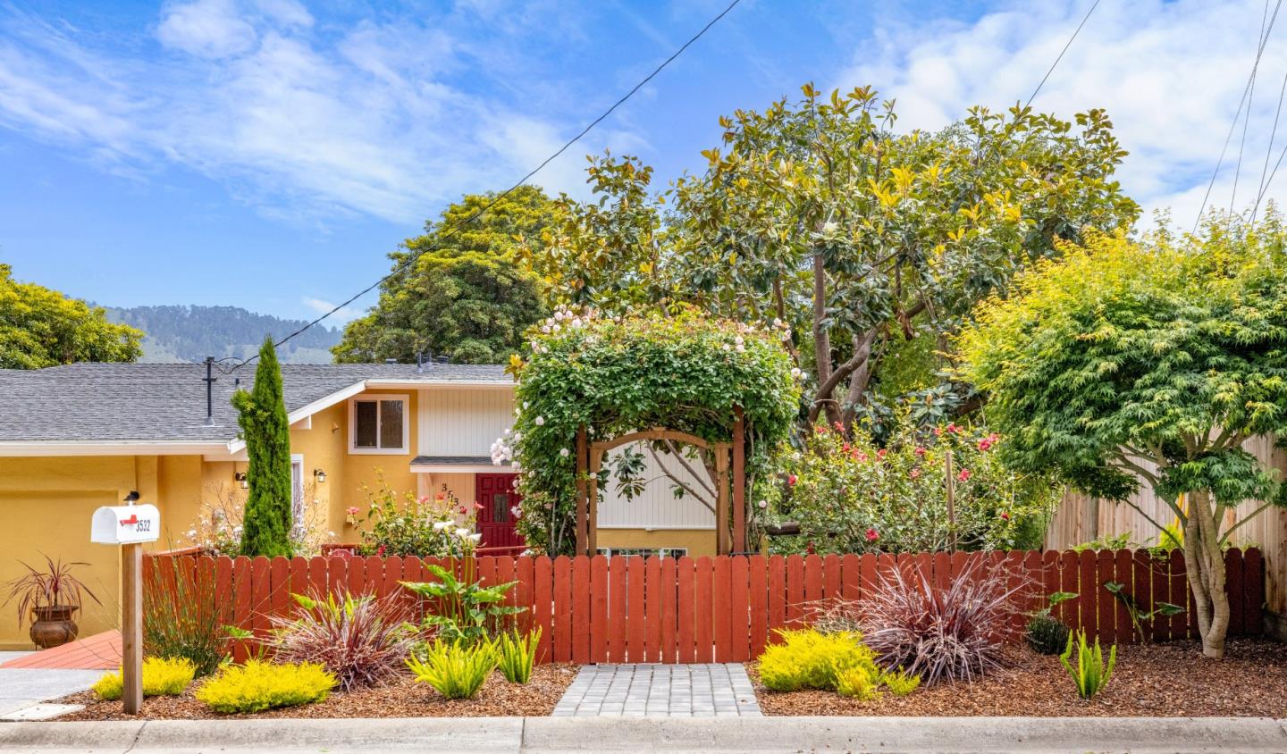3532 Oliver Road Carmel, CA 93923 - Photo 43 of 47 a front view of a house with a yard and a garden