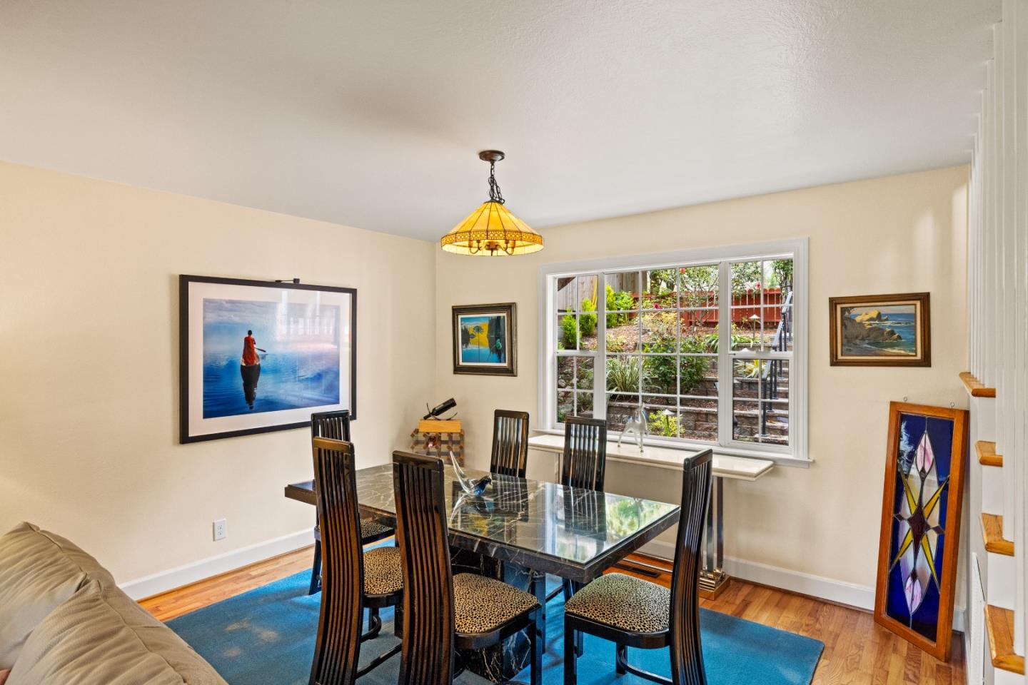 3532 Oliver Road Carmel, CA 93923 - Photo 6 of 47 a view of a dining room with furniture wooden floor and a chandelier