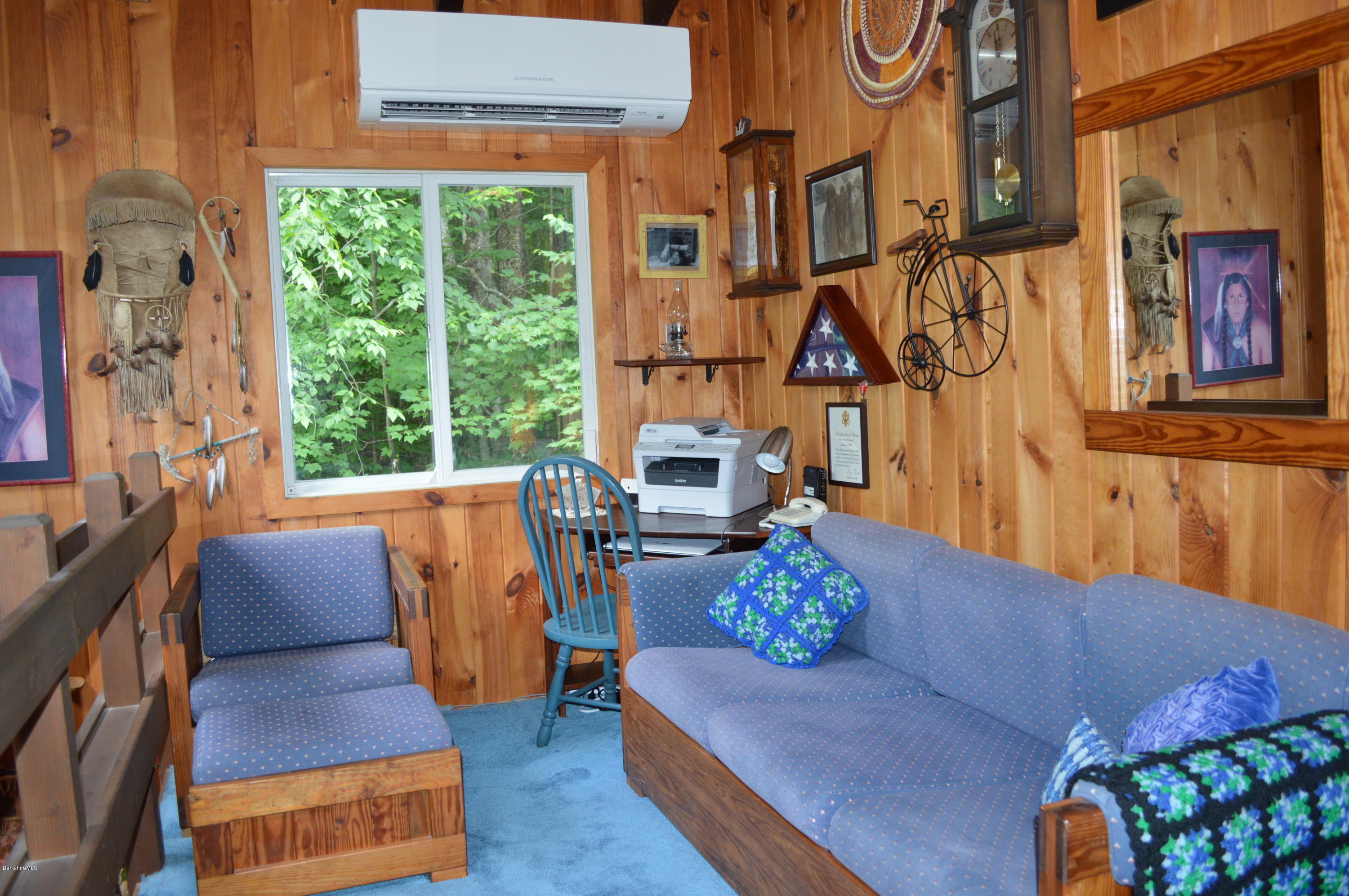 325 Bonny Rigg Hill Road Becket, MA 01223 - Photo 17 of 47 a living room with furniture fireplace and a large window