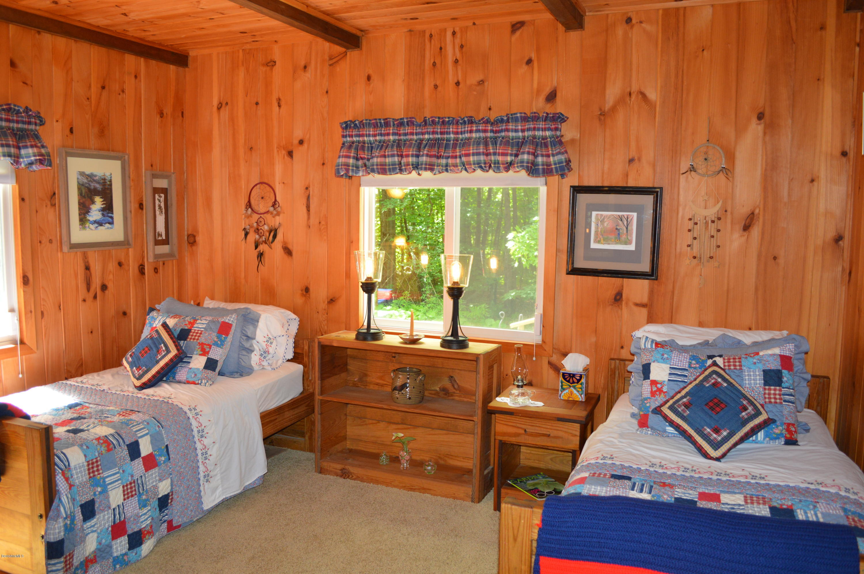 325 Bonny Rigg Hill Road Becket, MA 01223 - Photo 26 of 47 a bedroom with a bed and wooden floor