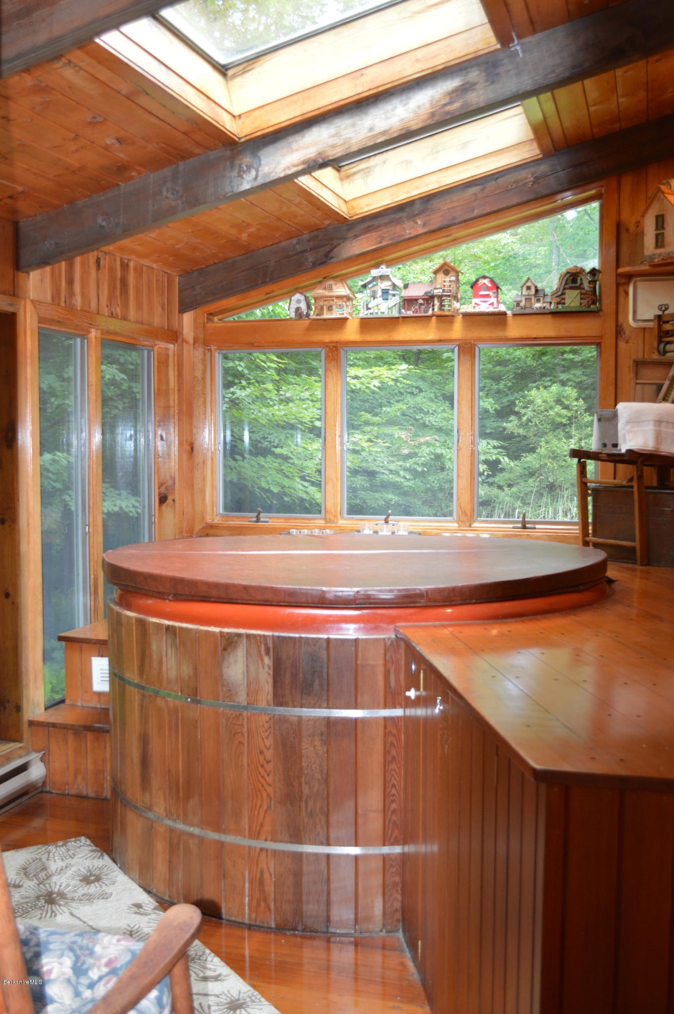 325 Bonny Rigg Hill Road Becket, MA 01223 - Photo 31 of 47 a room with a large window and table