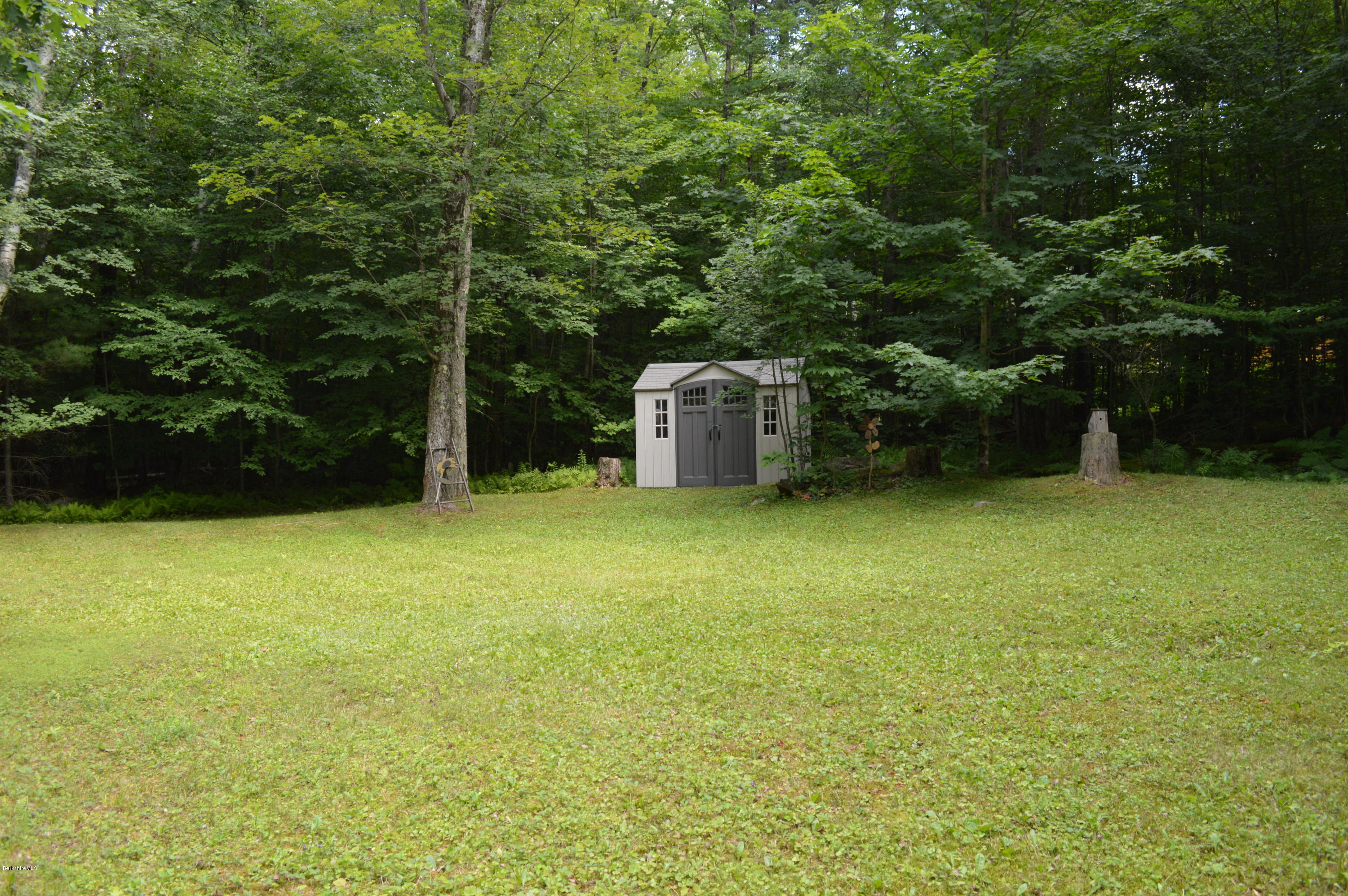 325 Bonny Rigg Hill Road Becket, MA 01223 - Photo 34 of 47 a view of a house with a backyard