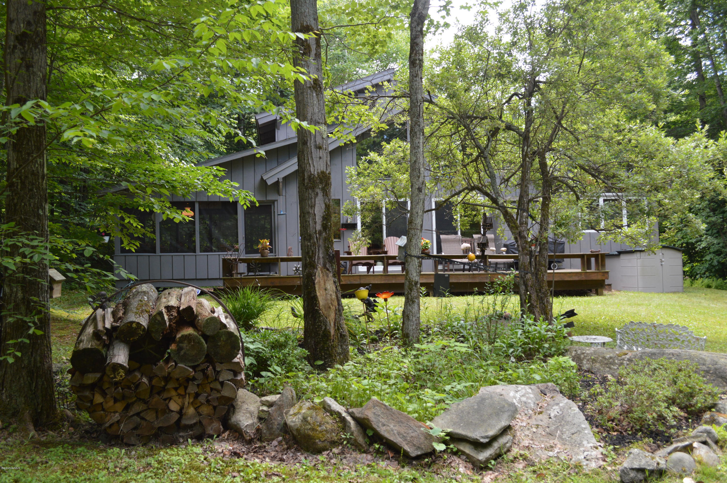 325 Bonny Rigg Hill Road Becket, MA 01223 - Photo 35 of 47 a backyard of a house with lots of green space