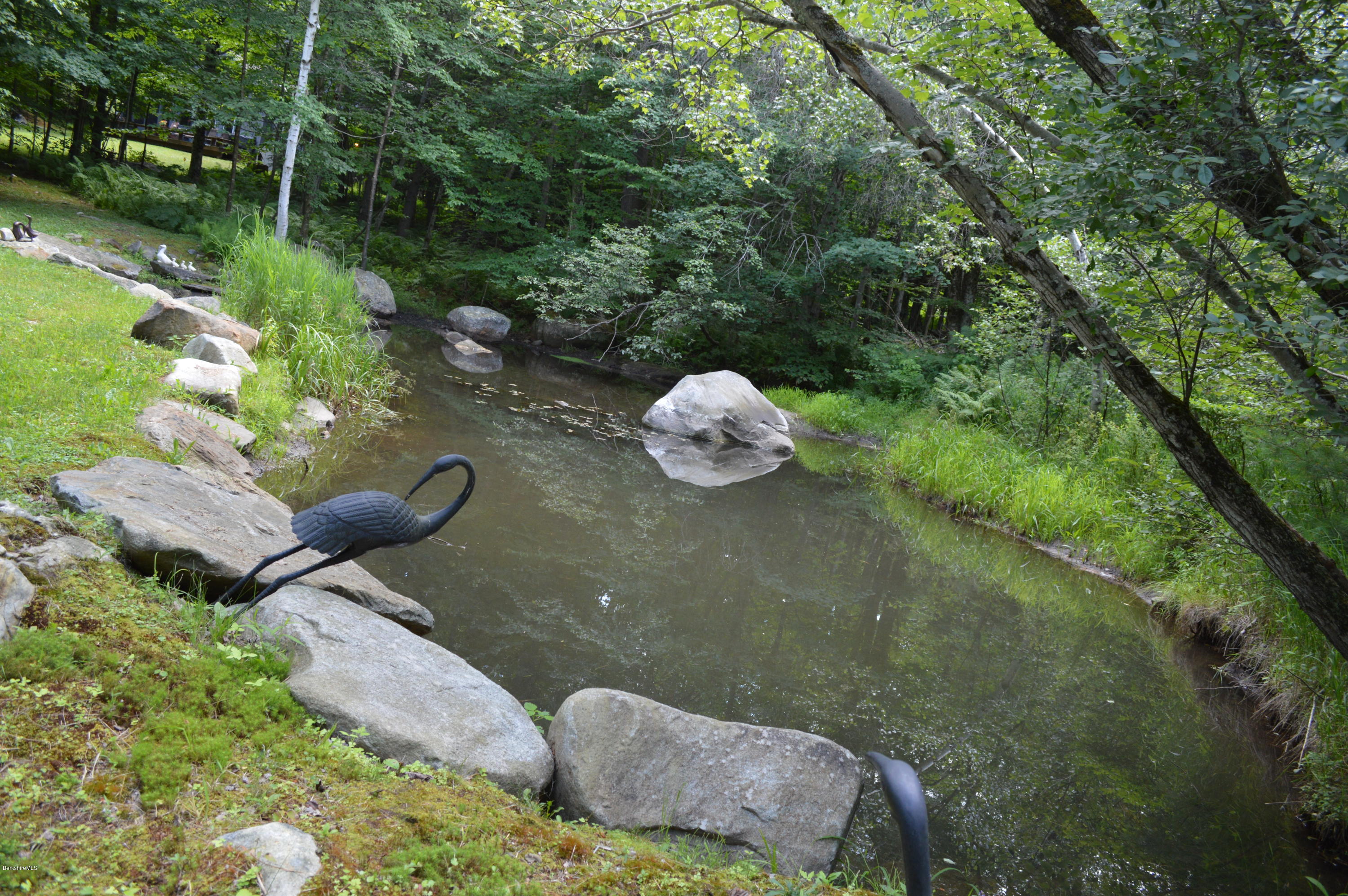 325 Bonny Rigg Hill Road Becket, MA 01223 - Photo 40 of 47 a backyard of a house with lots of green space