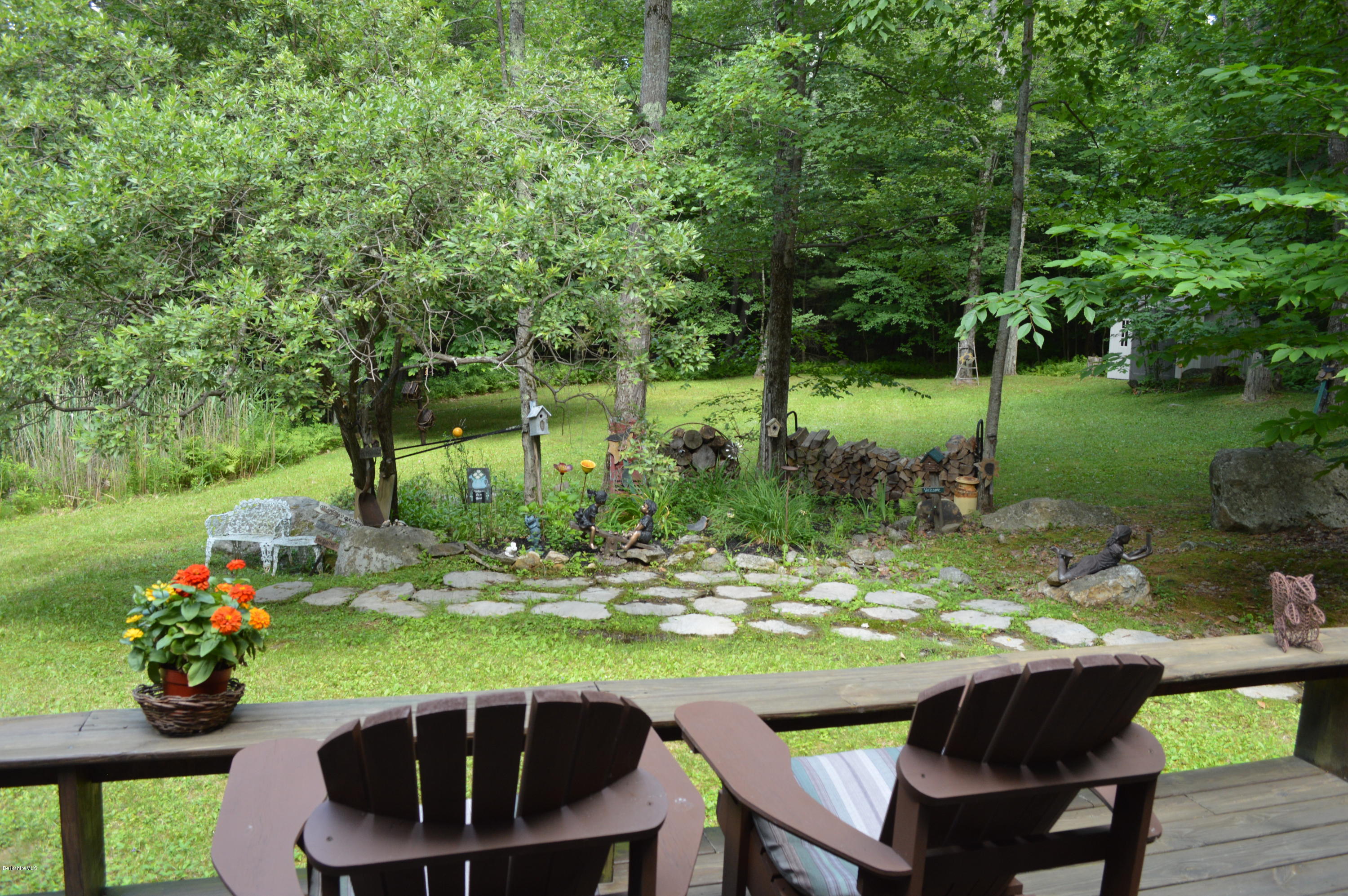 325 Bonny Rigg Hill Road Becket, MA 01223 - Photo 45 of 47 a view of a chairs and table in the garden