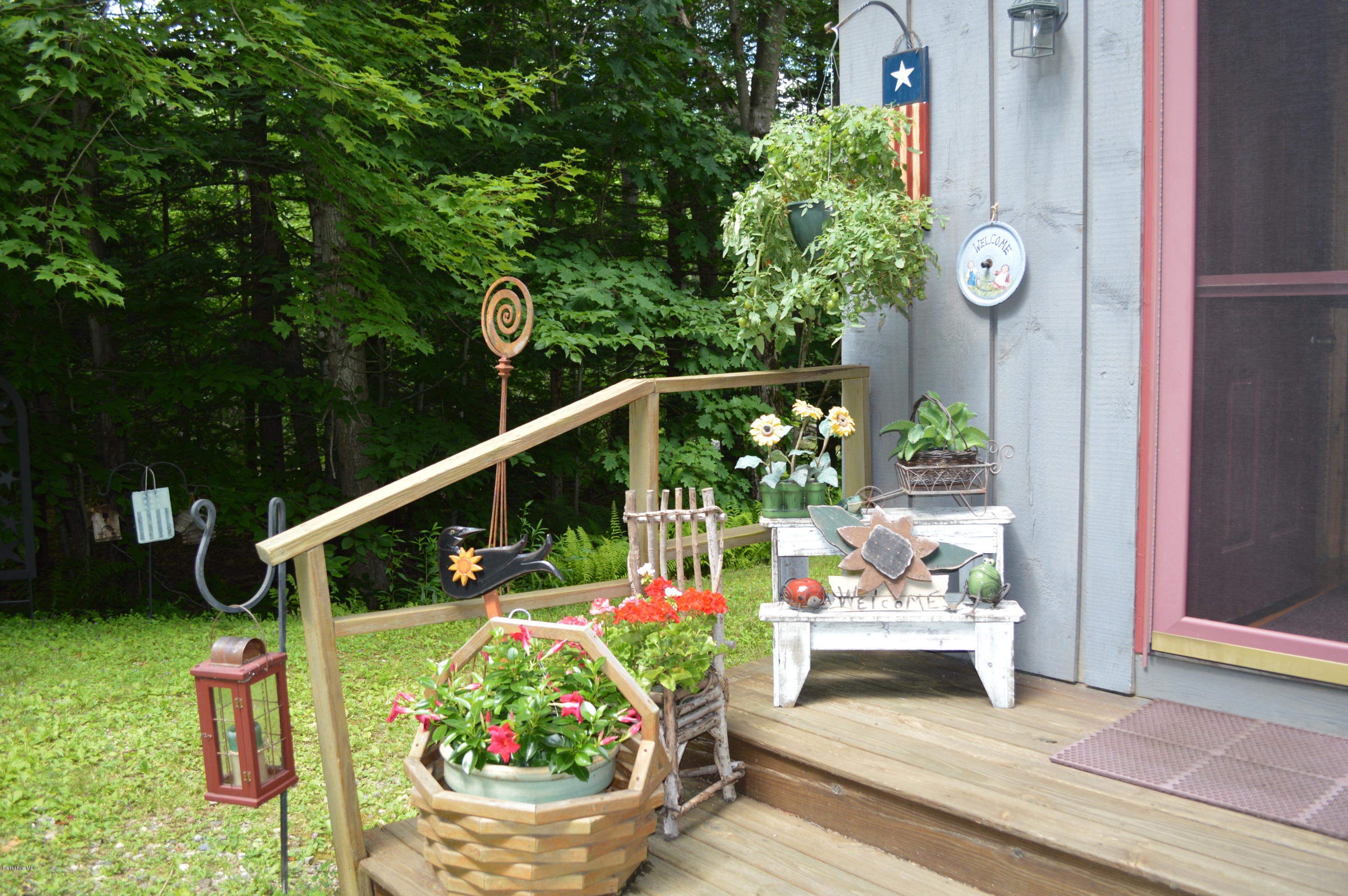 325 Bonny Rigg Hill Road Becket, MA 01223 - Photo 7 of 47 a balcony with lots of potted plants