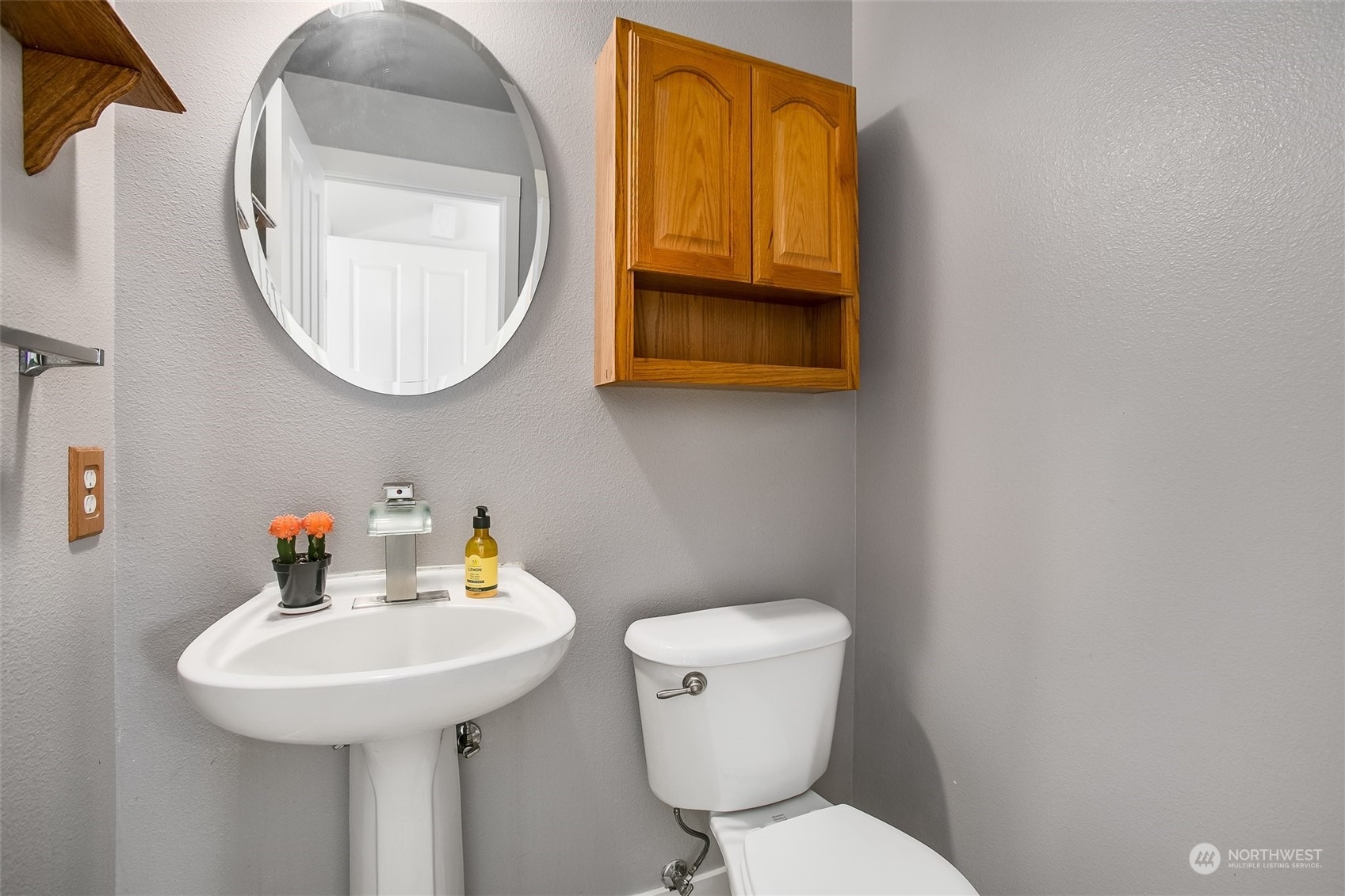 4109 South 220th Place, Unit 18 Kent, WA 98032 - Photo 12 of 29 a bathroom with a toilet a sink and a mirror