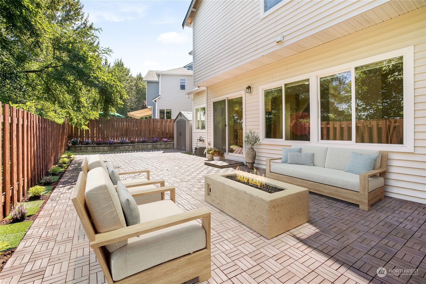 4109 South 220th Place, Unit 18 Kent, WA 98032 - Photo 23 of 29 a view of a patio with couches chairs and wooden floor