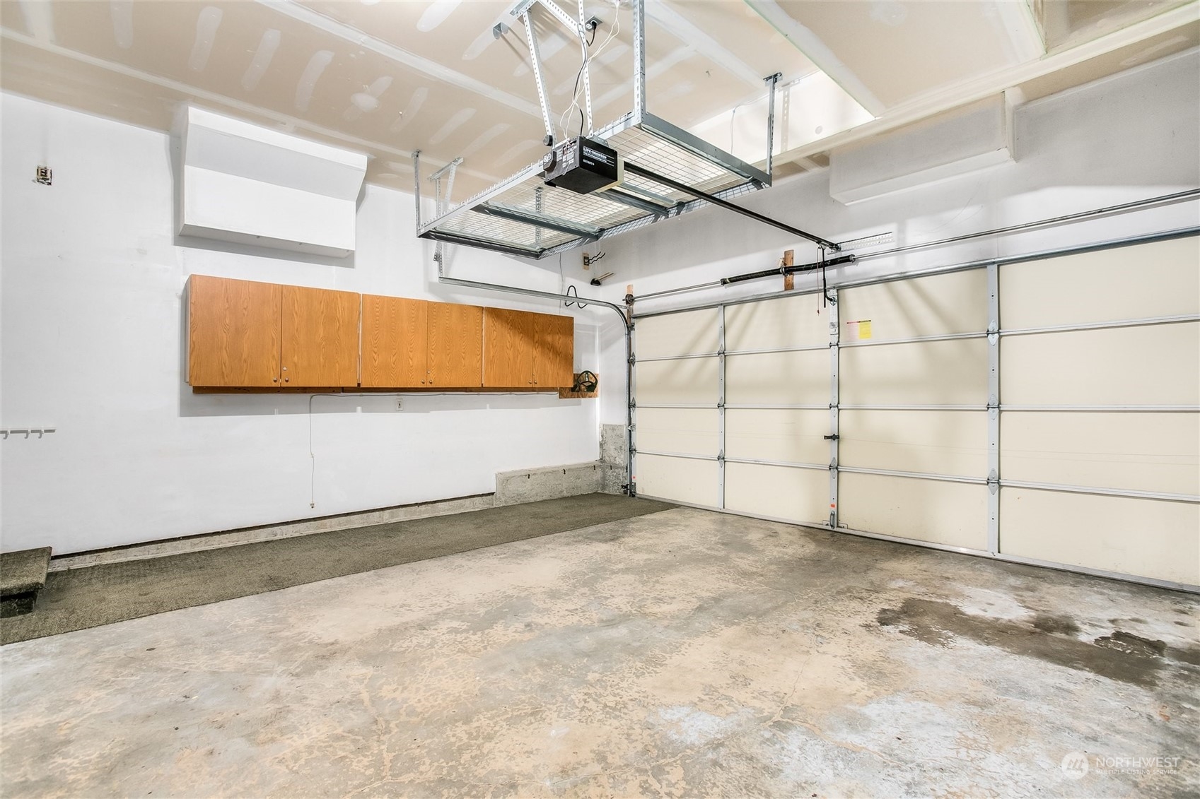4109 South 220th Place, Unit 18 Kent, WA 98032 - Photo 26 of 29 a view of a room with racks on the wall