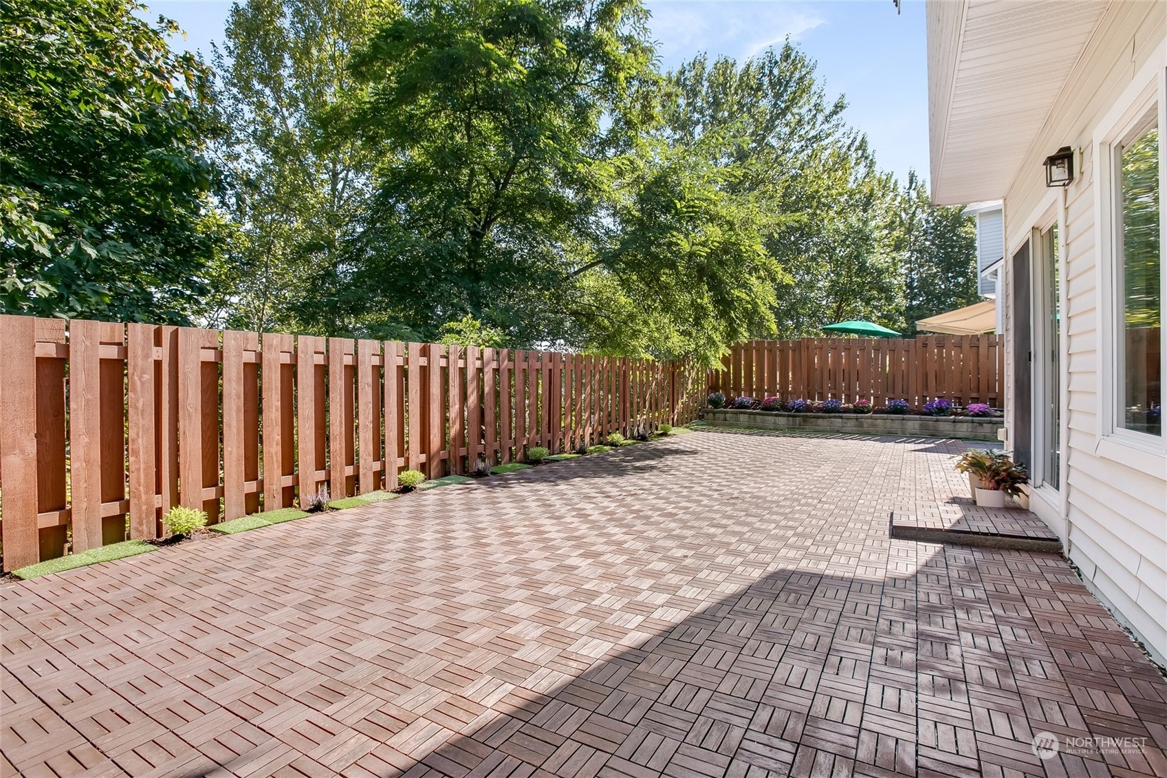 4109 South 220th Place, Unit 18 Kent, WA 98032 - Photo 3 of 29 a street view with wooden fence