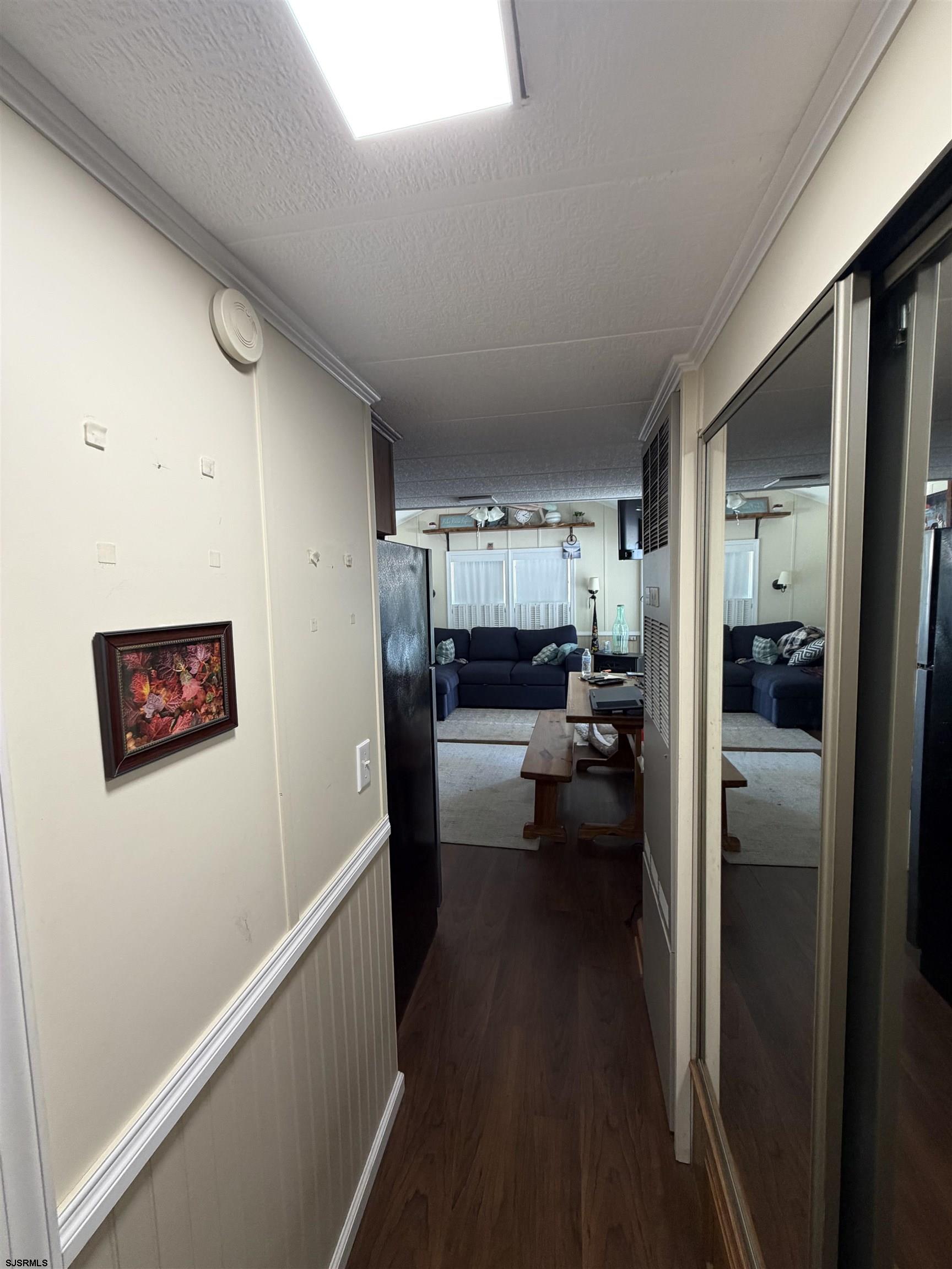 631 Chestnut Neck Road Port Republic, NJ 08241 - Photo 6 of 13 a view of a hallway and a livingroom with furniture