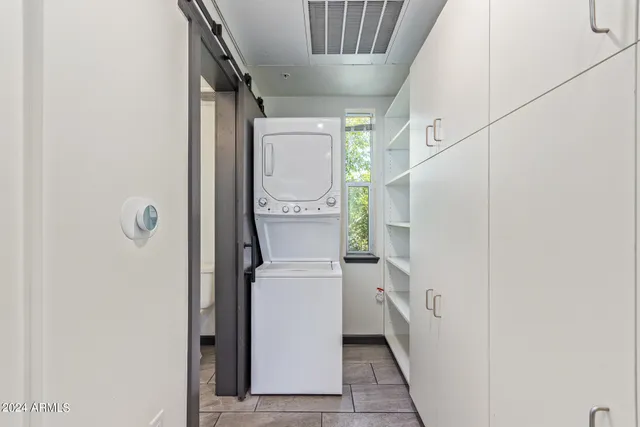 a utility room with cabinets