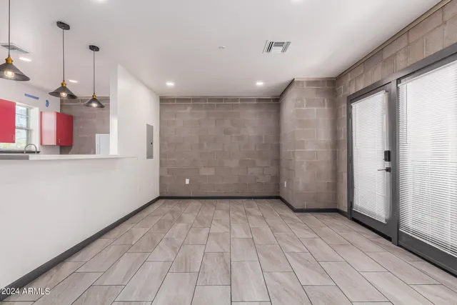 a view of a hallway with stairs