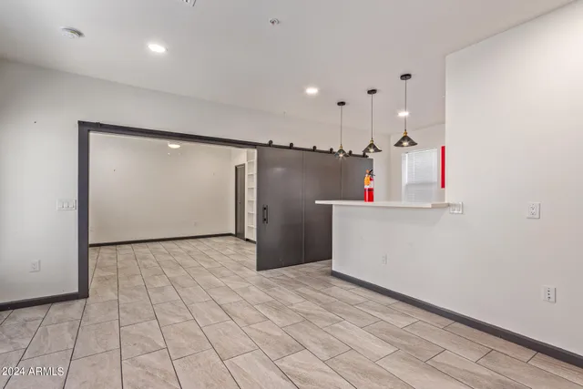 a view of a kitchen with a sink and an oven