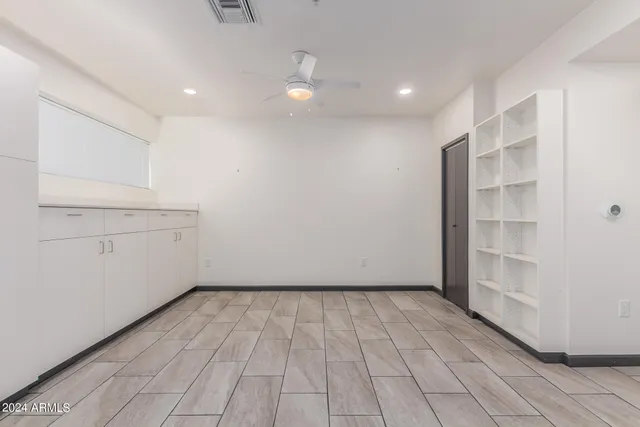 a view of an empty room with a window