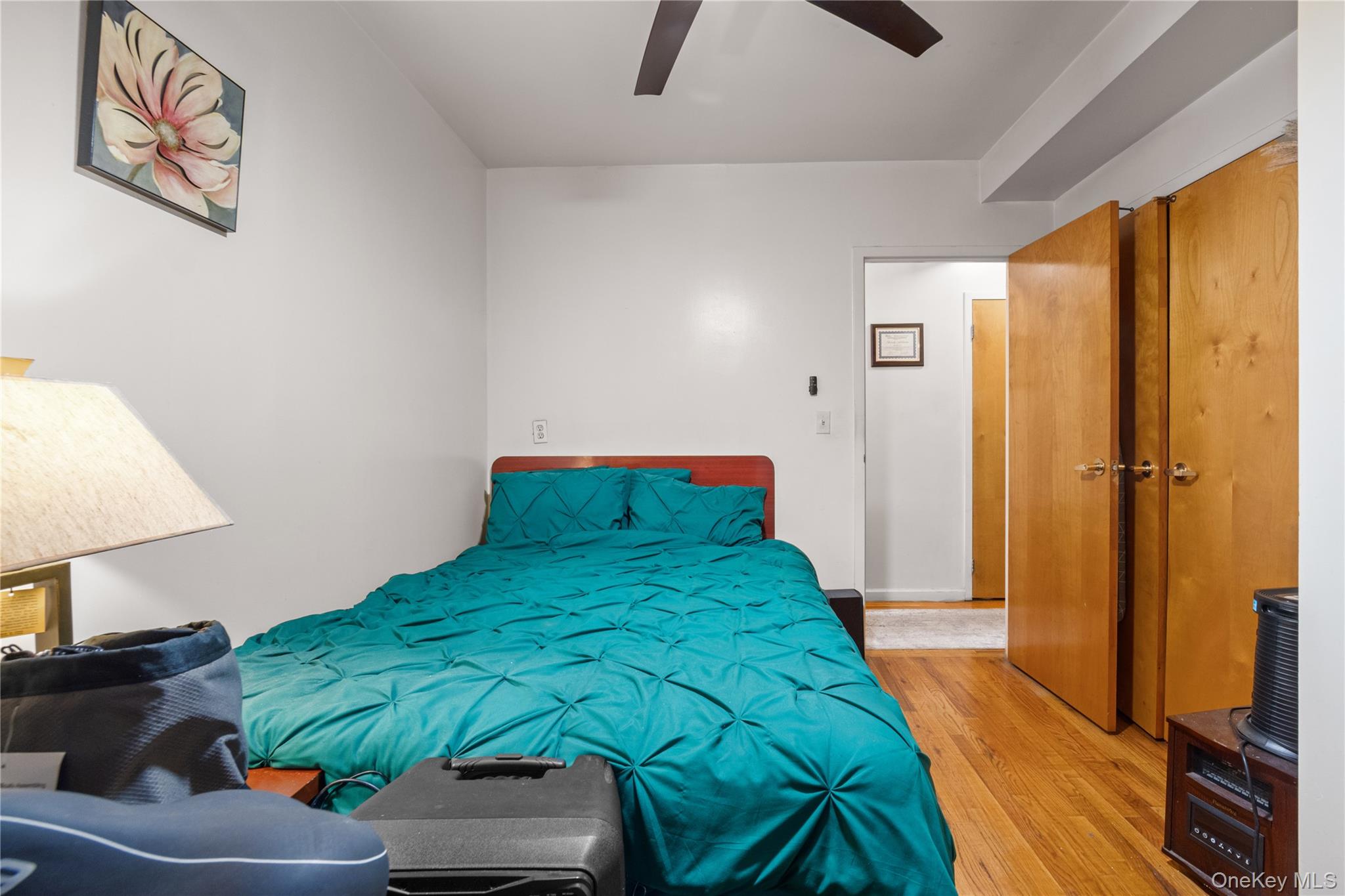 211 West 144th Street, Unit 2C Manhattan, NY 10030 - Photo 6 of 14 Bedroom featuring light wood-type flooring and a ceiling fan
