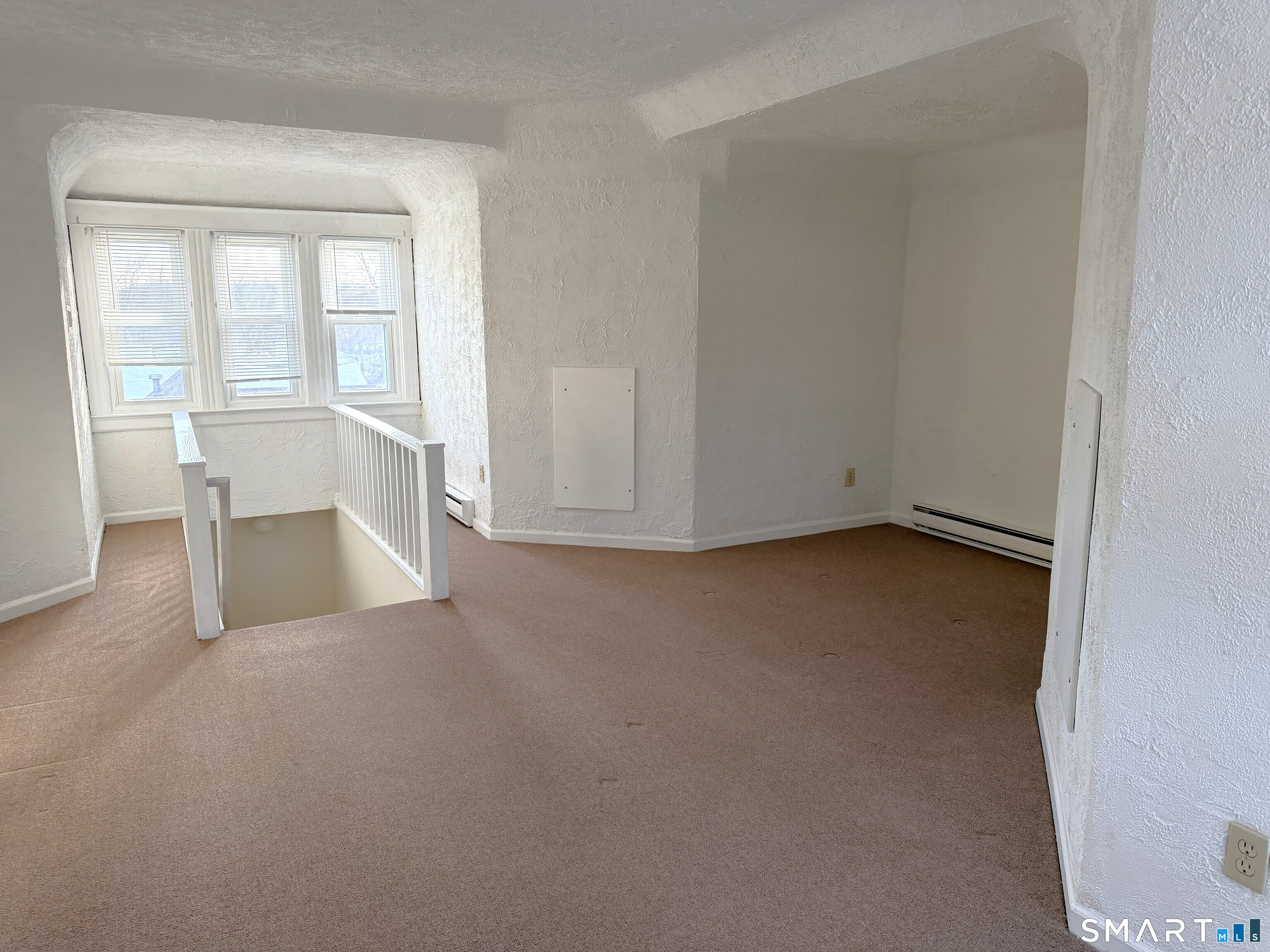 1273 Hope Street, Unit 2 Stamford, CT 06907 - Photo 11 of 14 an empty room with a fireplace