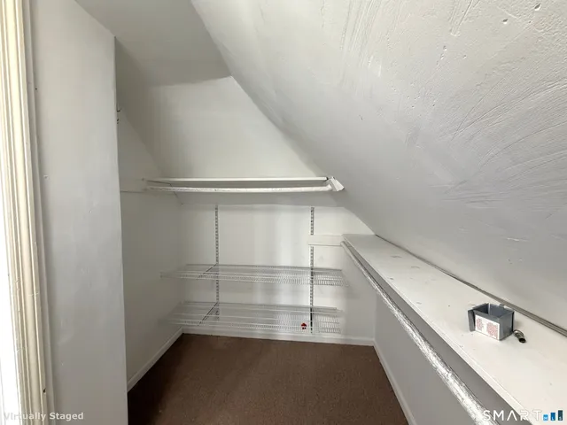 a view of storage and utility room with empty racks