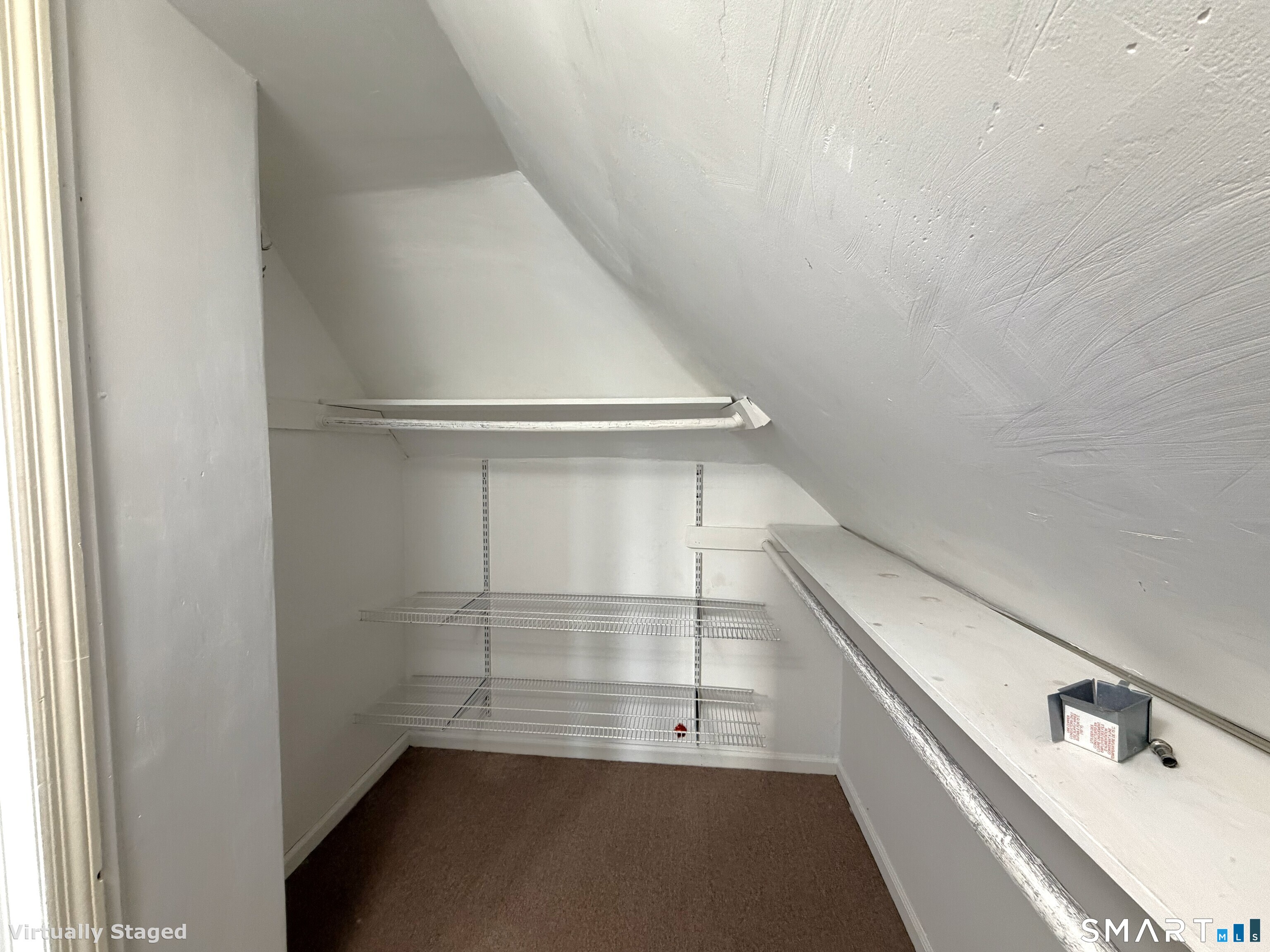 1273 Hope Street, Unit 2 Stamford, CT 06907 - Photo 13 of 14 a view of storage and utility room with empty racks