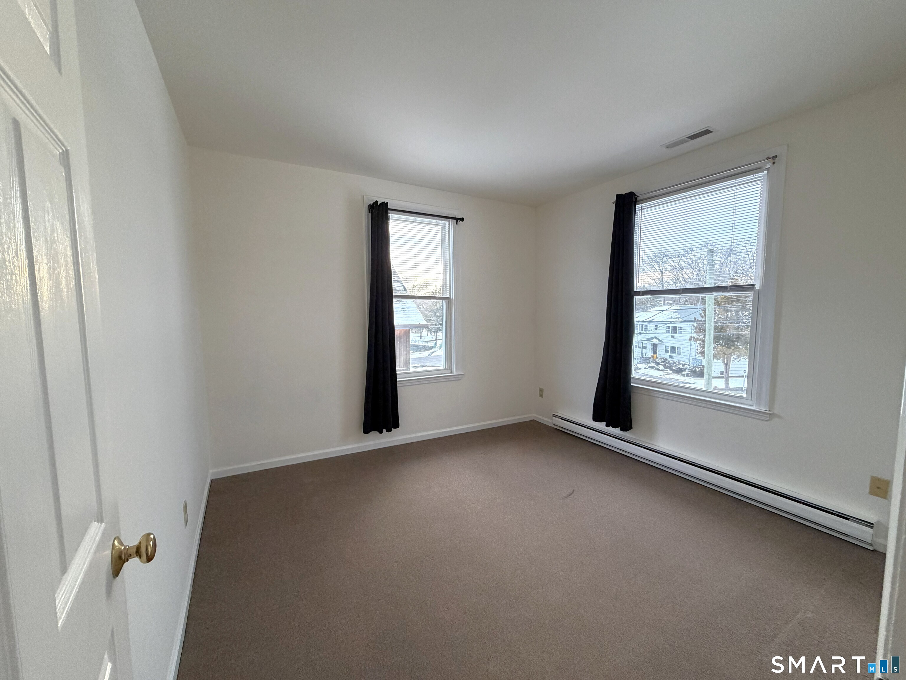 1273 Hope Street, Unit 2 Stamford, CT 06907 - Photo 6 of 14 an empty room with windows