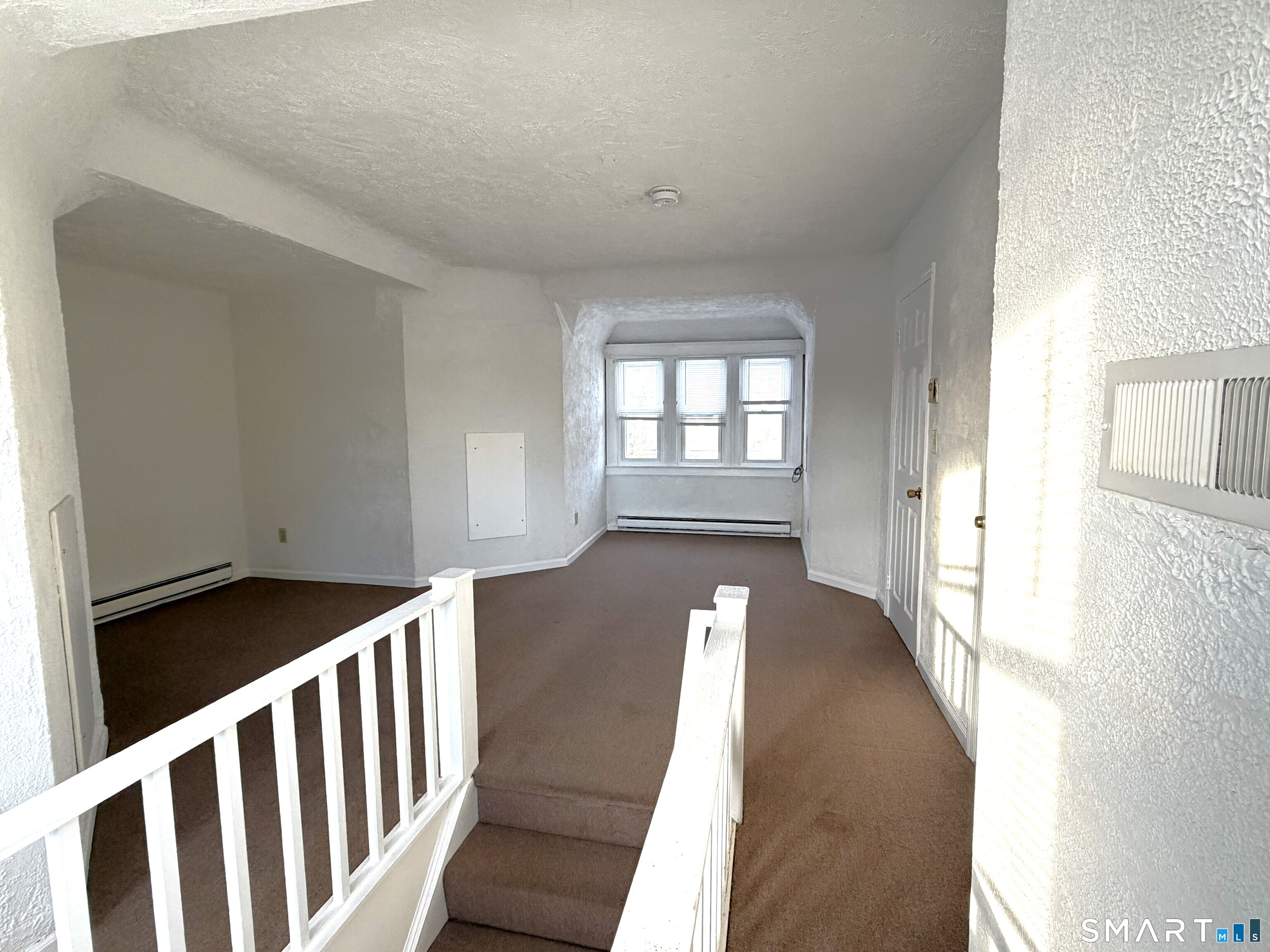 1273 Hope Street, Unit 2 Stamford, CT 06907 - Photo 10 of 14 a view of an empty room and window