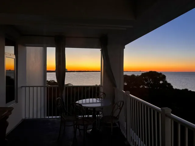 a view of balcony with furniture