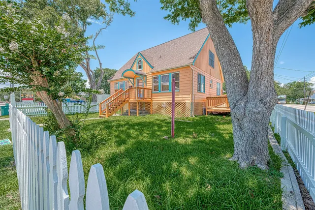 a view of backyard with deck and deck