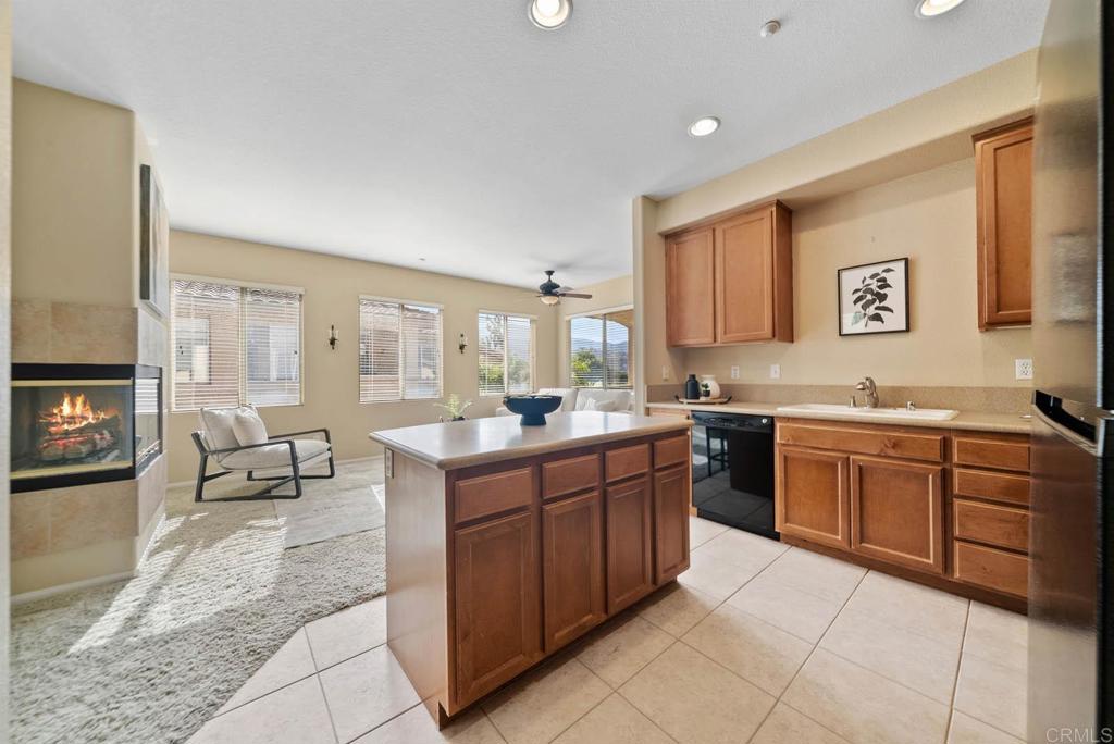 3223 Dehesa Road, Unit 32 El Cajon, CA 92019 - Photo 12 of 46 a large kitchen with stainless steel appliances granite countertop a sink and cabinets