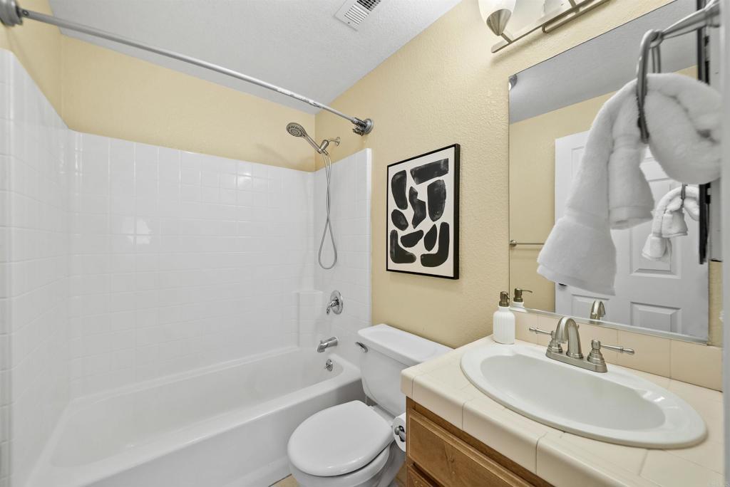 3223 Dehesa Road, Unit 32 El Cajon, CA 92019 - Photo 14 of 46 a bathroom with a sink mirror toilet and bathtub