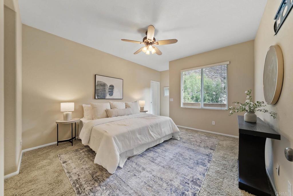 3223 Dehesa Road, Unit 32 El Cajon, CA 92019 - Photo 16 of 46 a bedroom with a bed and a chandelier