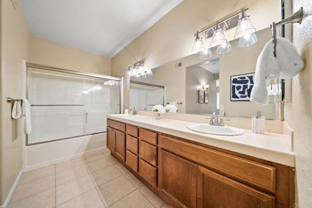 3223 Dehesa Road, Unit 32 El Cajon, CA 92019 - Photo 20 of 46 a spacious bathroom with a double vanity sink and a mirror