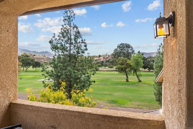 a view of a back yard from a balcony