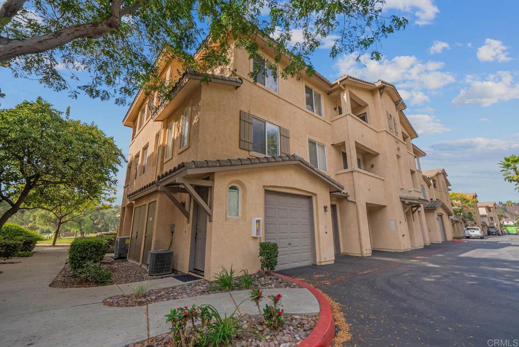 3223 Dehesa Road, Unit 32 El Cajon, CA 92019 - Photo 30 of 46 a front view of a house with a garden