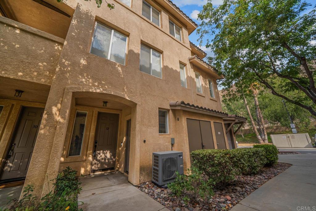 3223 Dehesa Road, Unit 32 El Cajon, CA 92019 - Photo 31 of 46 a front view of a house with a yard