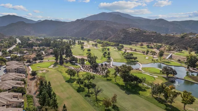 an aerial view of a house with outdoor space and lake view