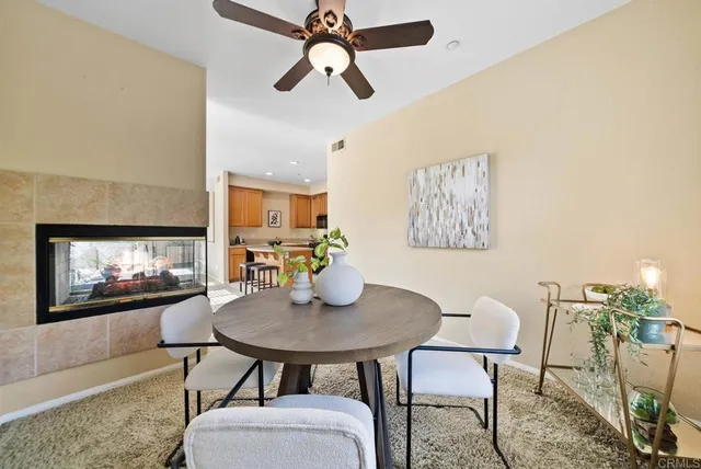 a dining room with furniture and window
