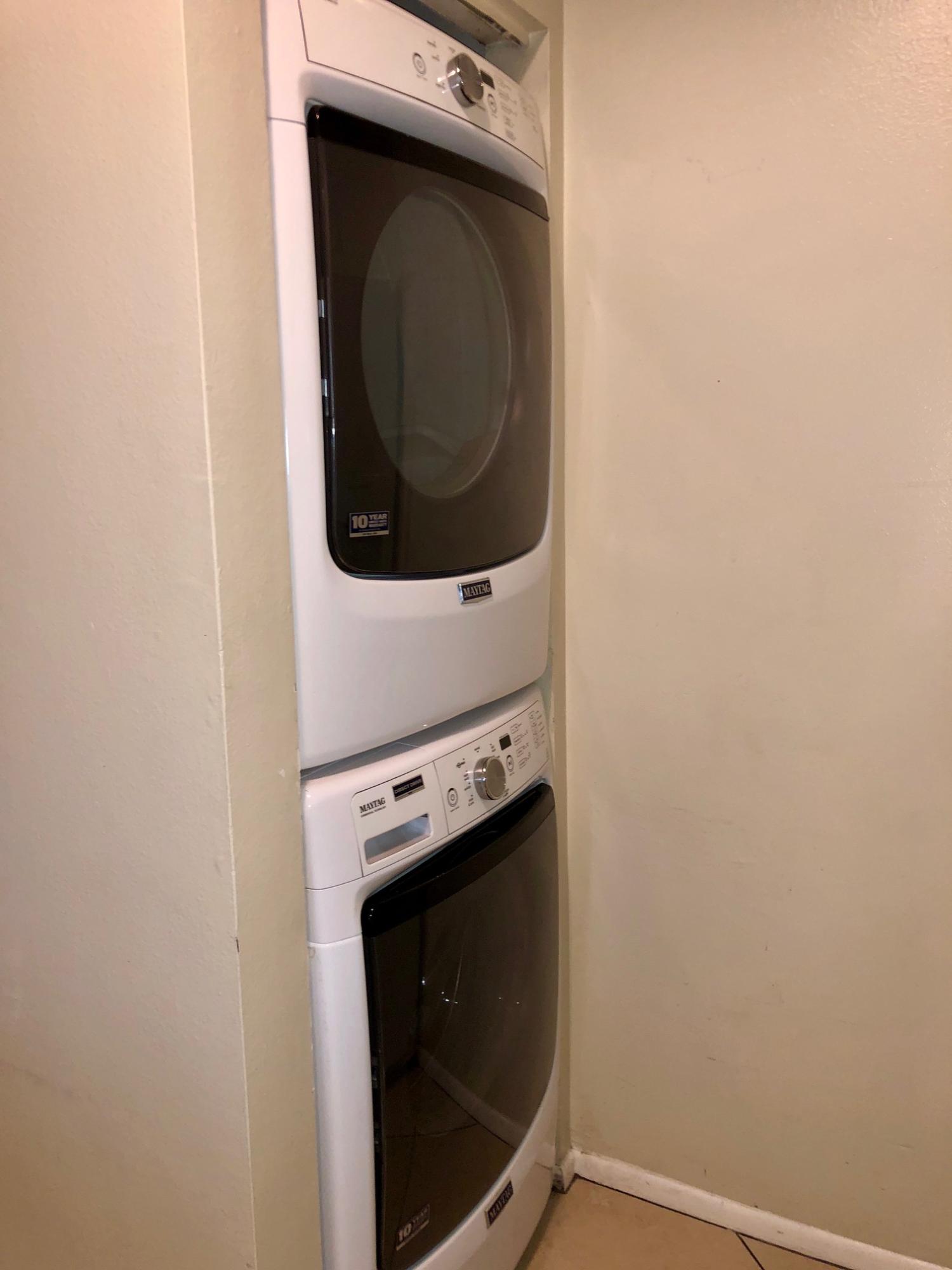 4799 Via Palm Lakes, Unit 1606 West Palm Beach, FL 33417 - Photo 12 of 29 a close up view of a washer and dryer