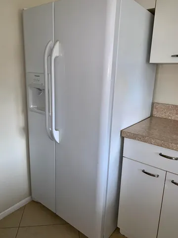 a view of park with large trees