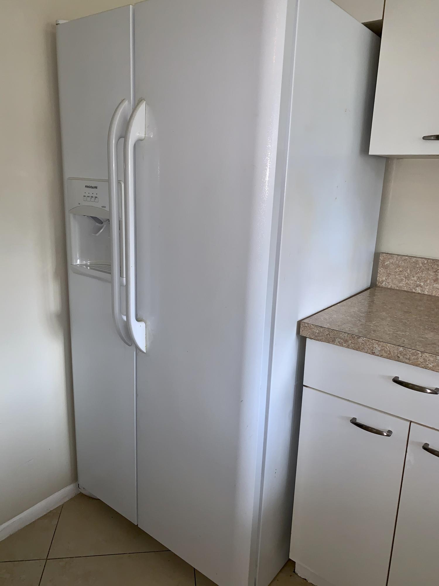4799 Via Palm Lakes, Unit 1606 West Palm Beach, FL 33417 - Photo 18 of 29 a bathroom with a granite countertop sink and a mirror