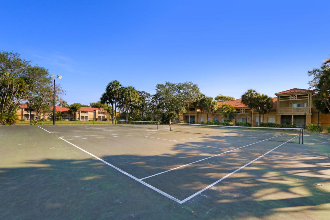 4799 Via Palm Lakes, Unit 1606 West Palm Beach, FL 33417 - Photo 20 of 29 a view of street with houses
