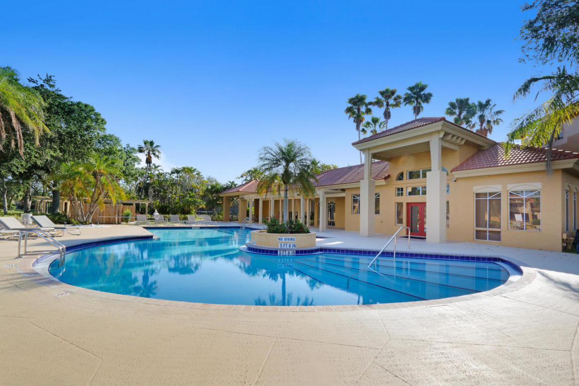4799 Via Palm Lakes, Unit 1606 West Palm Beach, FL 33417 - Photo 22 of 29 a view of a house with swimming pool