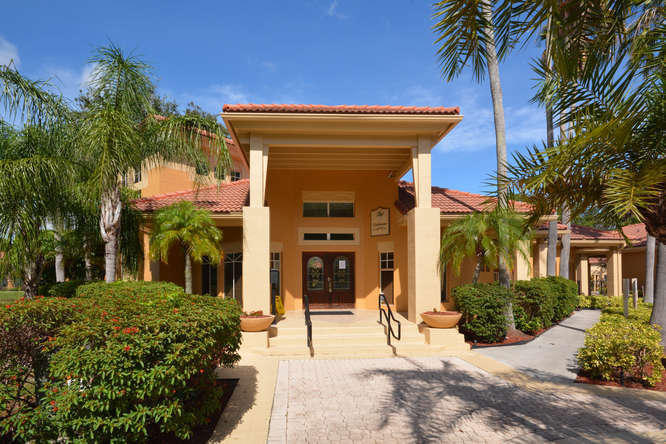 4799 Via Palm Lakes, Unit 1606 West Palm Beach, FL 33417 - Photo 24 of 29 a view of a house with a patio