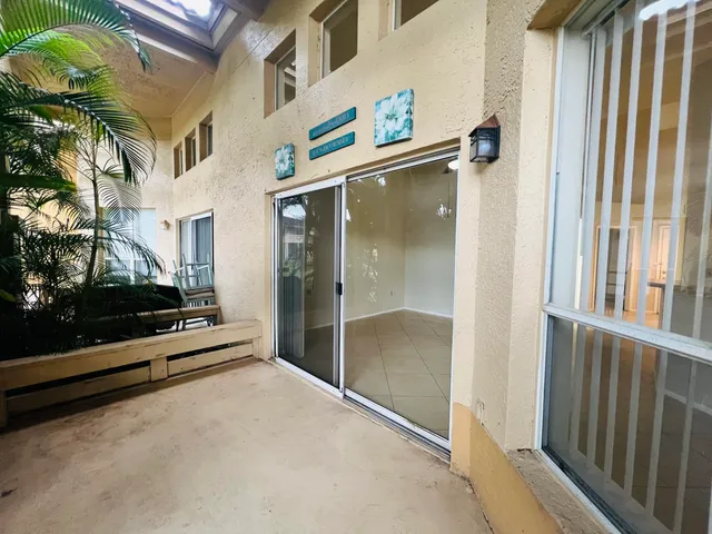 a large room with a large window and front door