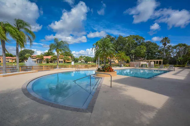 a view of swimming pool with seating