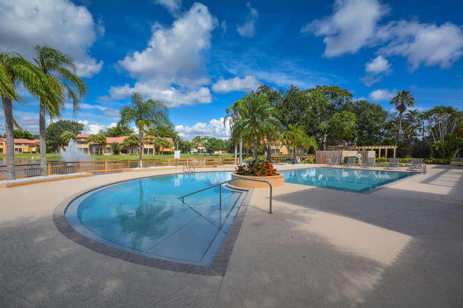 4799 Via Palm Lakes, Unit 1606 West Palm Beach, FL 33417 - Photo 25 of 29 a view of a swimming pool with an outdoor seating