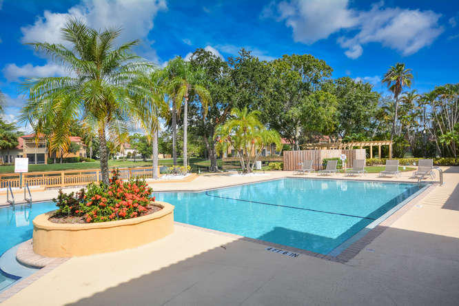 4799 Via Palm Lakes, Unit 1606 West Palm Beach, FL 33417 - Photo 27 of 29 a view of a swimming pool with a patio